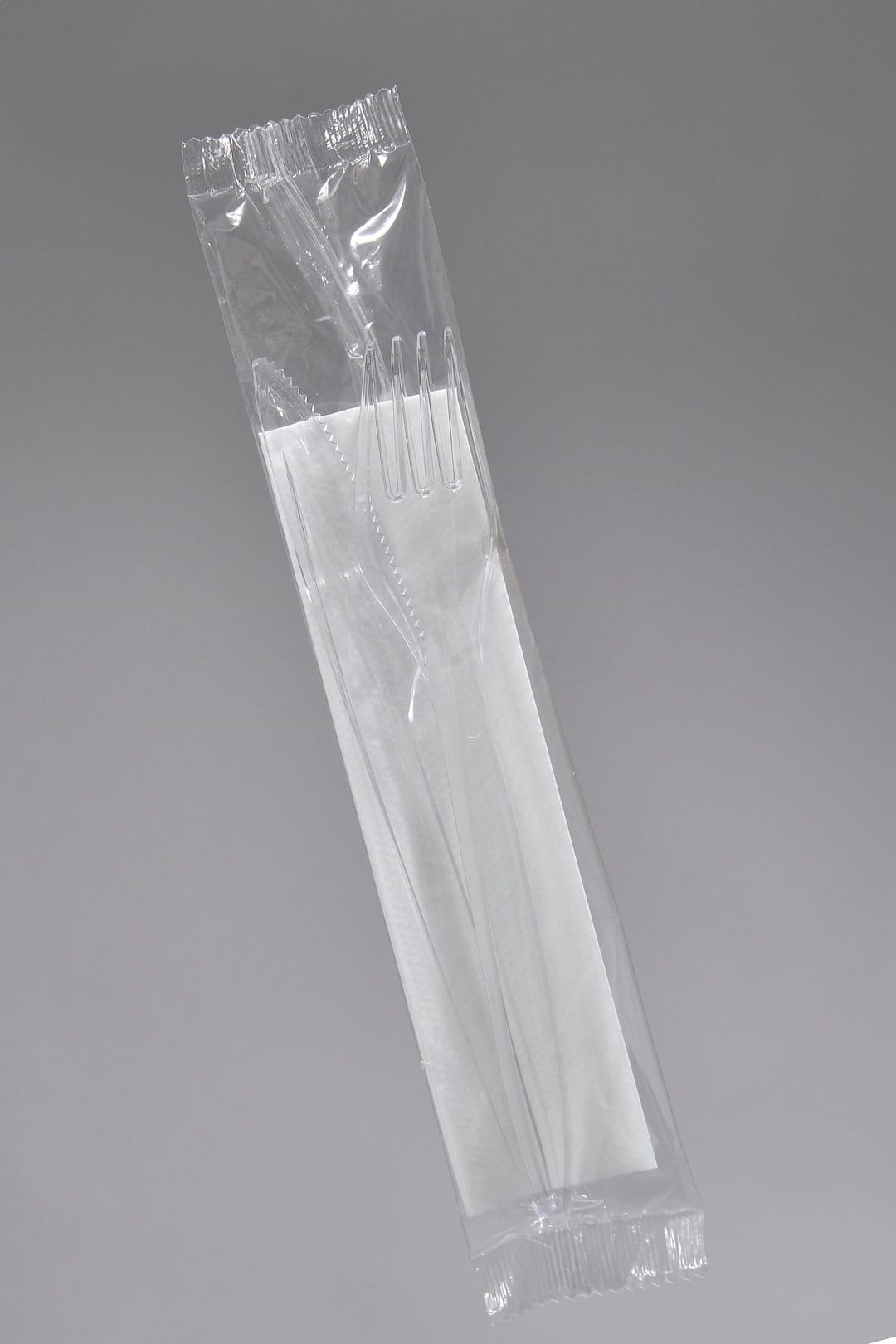 Zestaw sztućców transparent - widelec + nóż + serwetka  op.350 szt.   AT